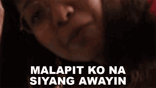 a close up of a woman wearing glasses with the words malapit ko na siyang awayin written below her .