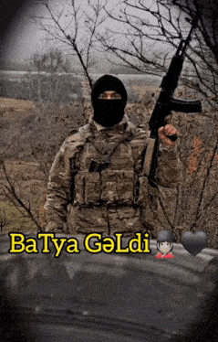 a man in a mask holding a gun with the words batya geldig written below him
