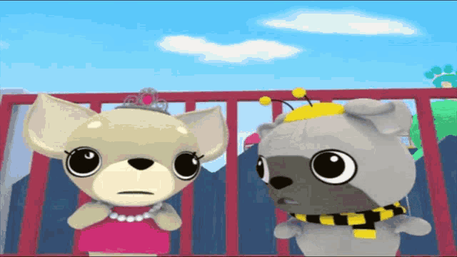 two stuffed animals standing next to each other one wearing a tiara