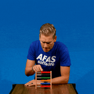 a man wearing a blue afas software shirt looks at an abacus