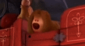 a stuffed animal is sitting in a red wagon .