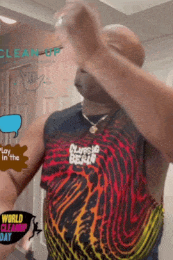 a man wearing a tank top that says clubbing berlin on it