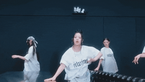 a girl wearing a white shirt that says ' return ' on the front