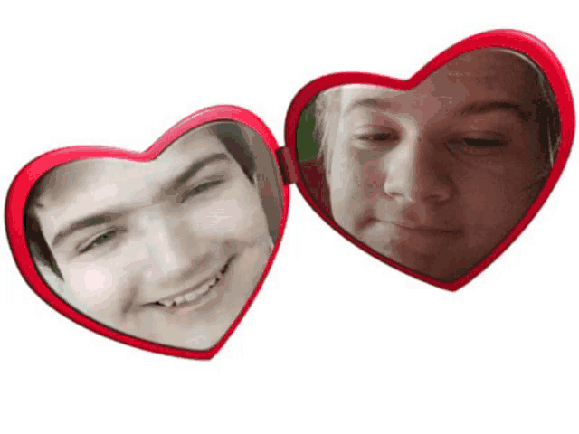 two red heart shaped mirrors with two faces on them