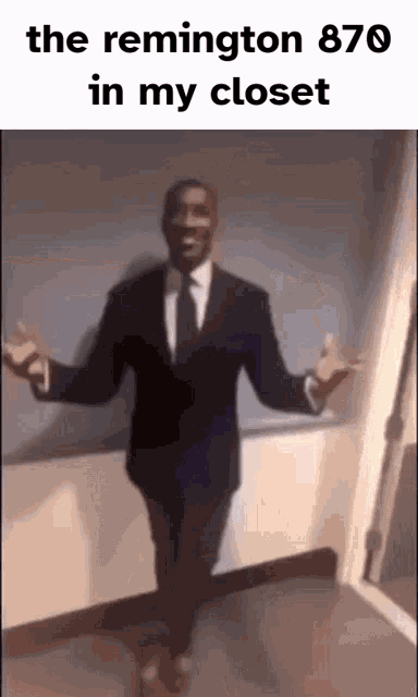 a man in a suit and tie is dancing in a hallway with the remington 870 in his closet