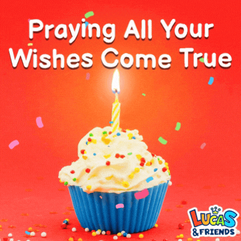 a birthday cupcake with a lit candle and the words " praying all your wishes come true "