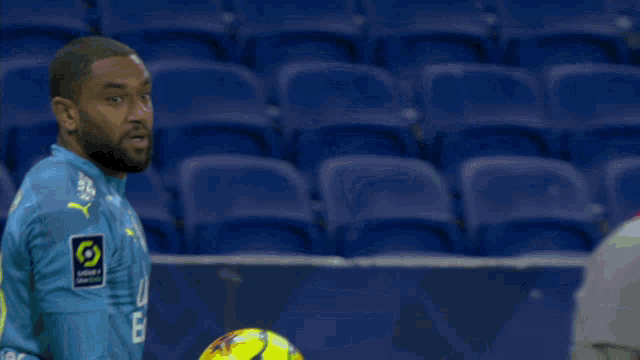 a man wearing a jersey with the number 18 on the back