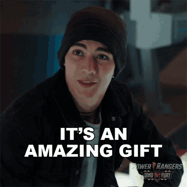 a young man wearing a beanie says it 's an amazing gift from power rangers