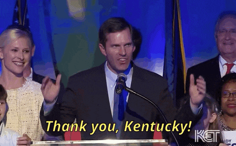 a man stands at a podium with the words thank you kentucky