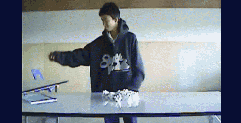 a person wearing a sweatshirt that says ' supreme ' on the front