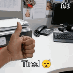a person is giving a thumbs up with the word tired below it