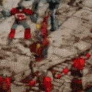 a blurry picture of a group of transformers fighting each other
