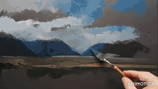 a person is painting a landscape with the words made in animotica below it