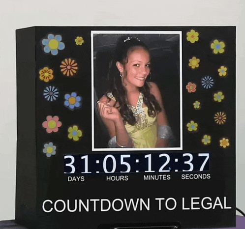 a clock with a picture of a girl and the words countdown to legal on the bottom