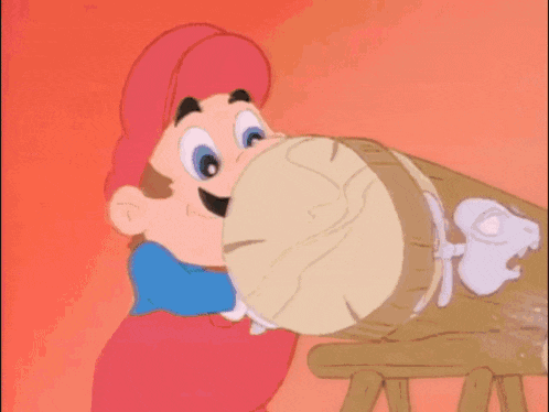 a cartoon character named luigi is sitting at a wooden table with his hands outstretched .