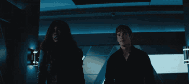 a man and a woman are standing next to each other