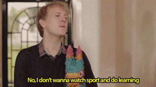 a young man is holding a piñata and says no , i don 't wanna watch sport and do learning .
