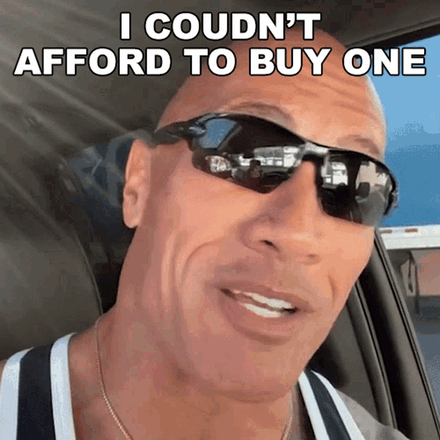 a bald man wearing sunglasses says i could n't afford to buy one