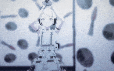 a girl in a white dress stands in front of a wall with circles on it