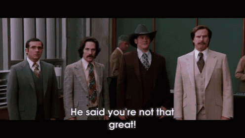a group of men are standing next to each other and one of them is wearing a cowboy hat