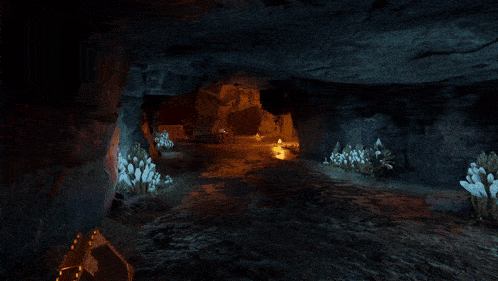 a person holding a book in a cave with purple glowing circles