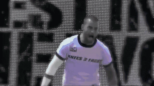 a man in a shirt that says knees 2 faces