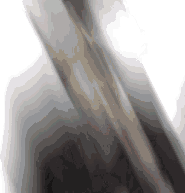 a blurred image of a metal object on a white background .