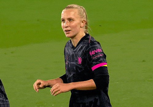 a female soccer player wearing a jersey with the number 10