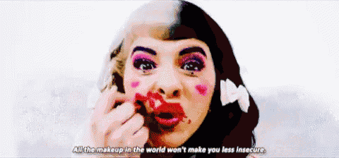 a woman with red lipstick on her face says all the makeup in the world won 't make you less insecure