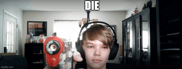 a young boy wearing headphones and holding a toy gun with the word die written above him