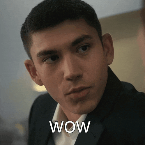a close up of a man 's face with the word wow on it