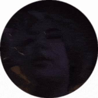 a close up of a person 's face with a purple background