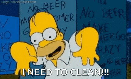 homer simpson is standing in front of a sign that says `` no beer no beer '' .