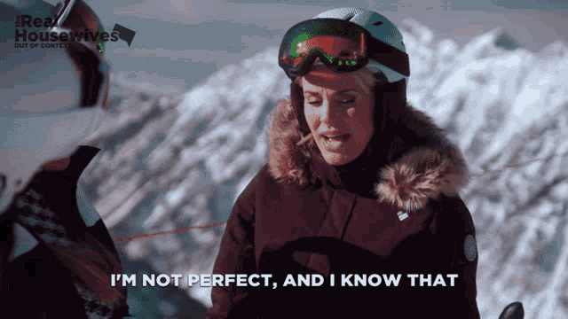 a woman wearing a ski helmet and goggles says " i 'm not perfect and i know that "