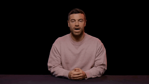 a man wearing a pink sweater says " howp "