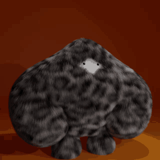 a stuffed animal with a small white spot on its head