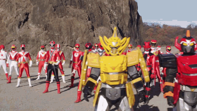 a group of red and white power rangers are standing in a line