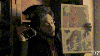 a man is holding a map and talking on a phone