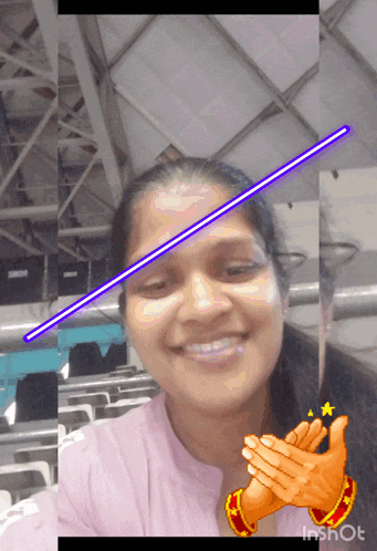 a woman is smiling with a purple line on her forehead and applauding