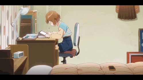 a girl is sitting at a desk writing on a piece of paper in a room
