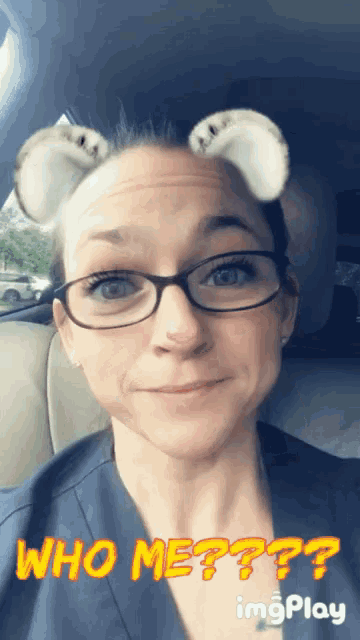 a woman wearing glasses and bunny ears with the caption who me ?