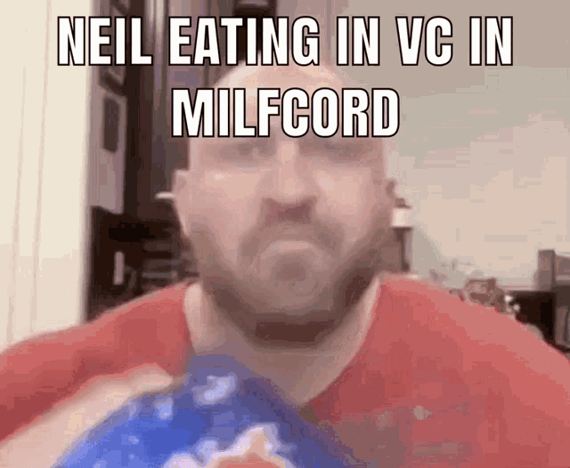 a man in a red shirt is eating a bag of chips with the caption " neil eating in vc in milfcord "