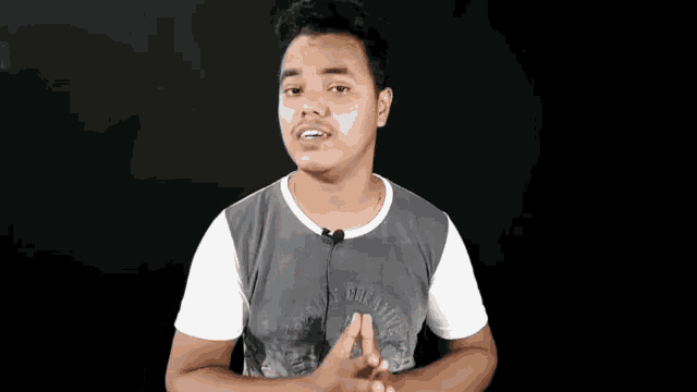 a young man wearing a t-shirt that says ' freedom of expression ' on it