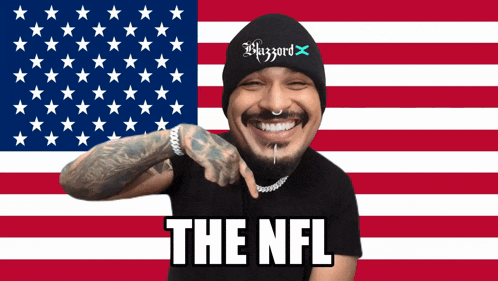 a man in front of an american flag with the nfl written on it
