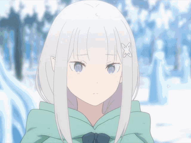 a girl with white hair is wearing a green hoodie
