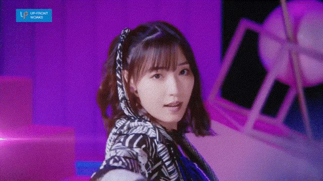 a girl with a scarf around her head is standing in front of a purple background that says upfront works