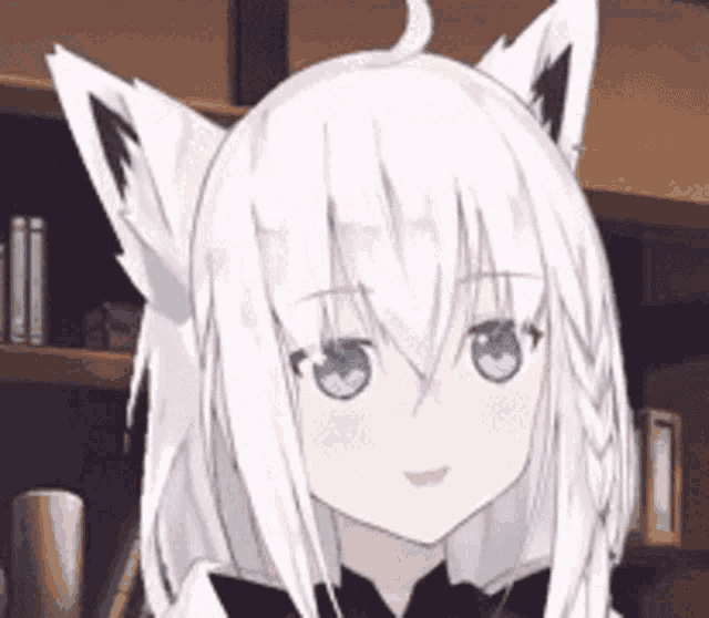 a girl with white hair and green eyes is smiling .