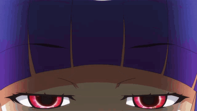 a close up of a person 's eyes with purple hair