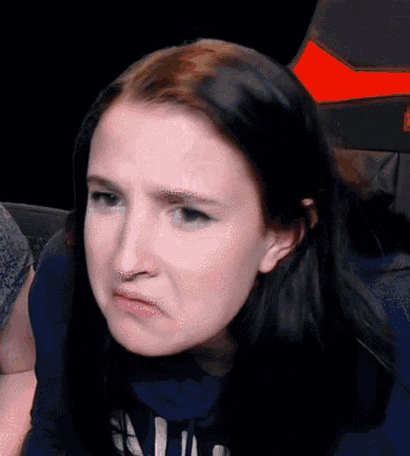 a close up of a woman making a funny face