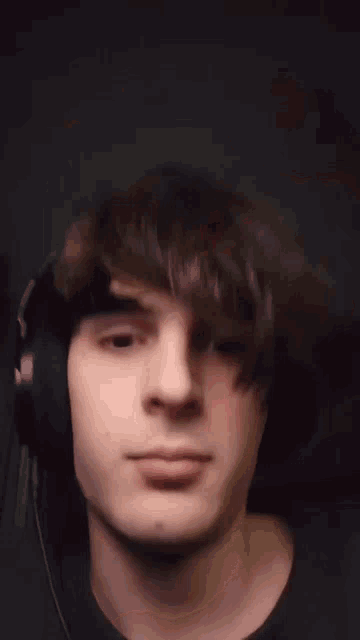 a close up of a man 's face with his mouth open